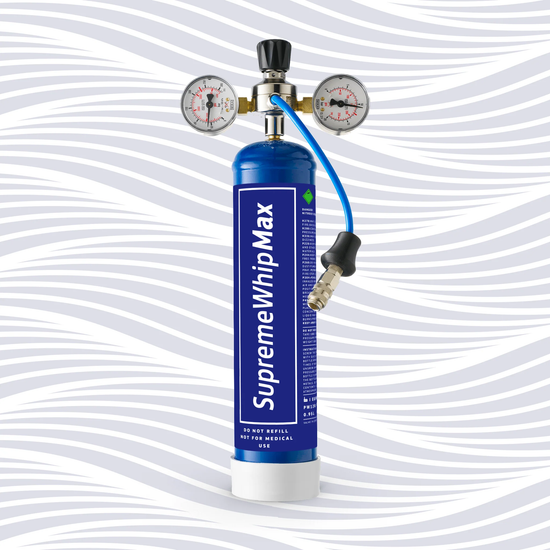 SupremewhipMAX 580g N2O canister connected to a whipped cream dispenser with pressure regulator setup